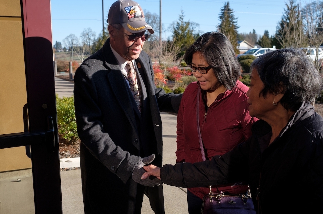 Mike Calderon greets parishioners before Mass at St. John the Evangelist Catholic Church on Sunday, March 3, 2019 in Vancouver, Washington. (PHOTO by Stephen Brashear)