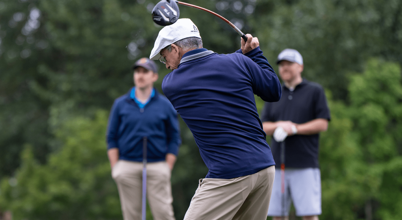 A bishop swinging a golf club