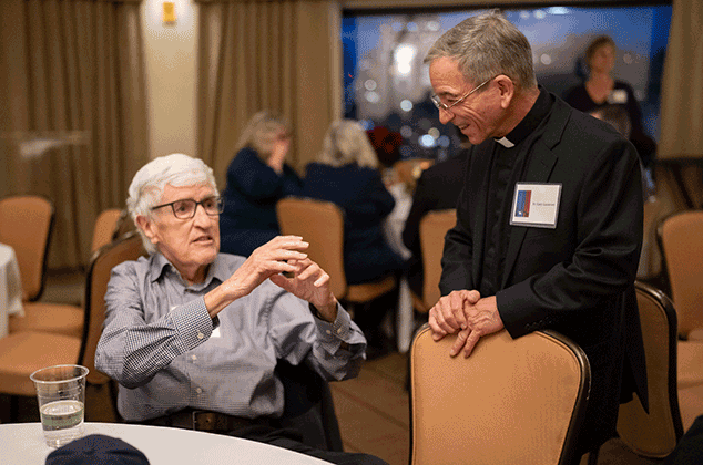 Father Lazzeroni talking to someone