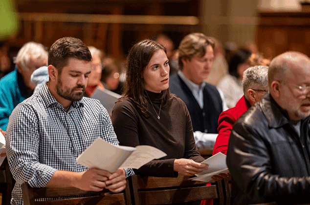 People worshipping at a Mass