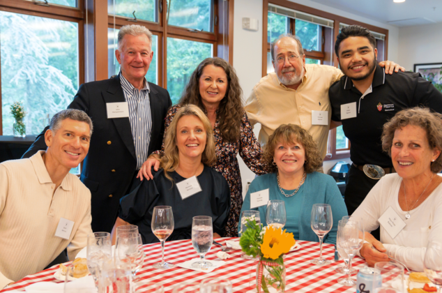 People posing for a photo at a Crozier Society Barbeque