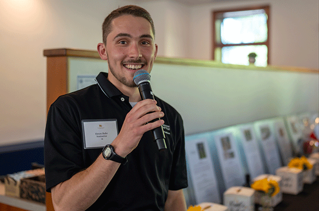 A seminarian talking at the 2025 BBQ