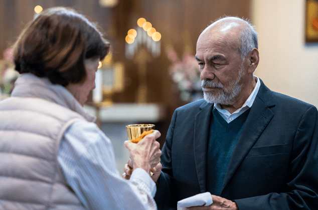 people getting items ready for communion