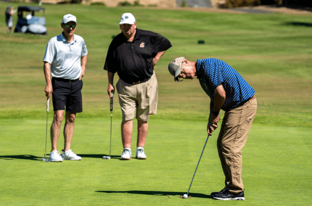 Archbishop Etienne putting on the green