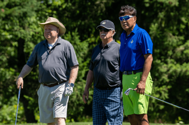 People watching golfers