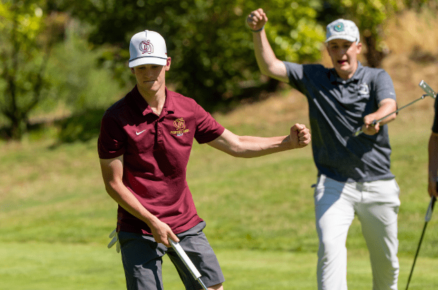Young men celebrating a good golf shot
