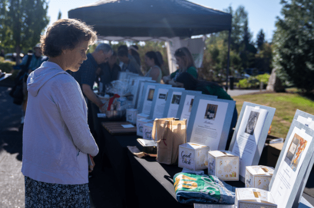 A woman looking auction items